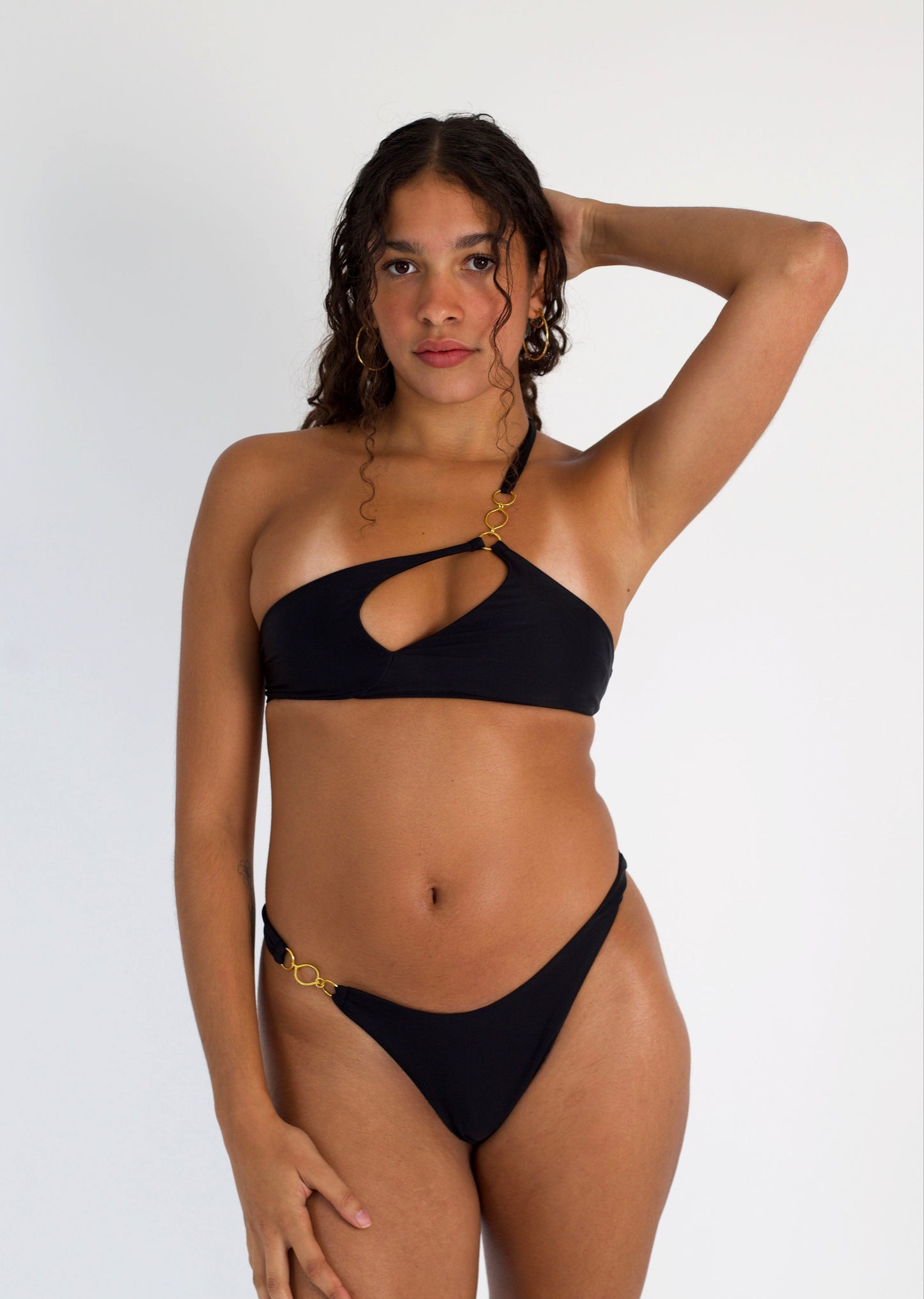 Leah Loves Ivy Asymmetric Bikini Top in Black with Gold Hardware - Front