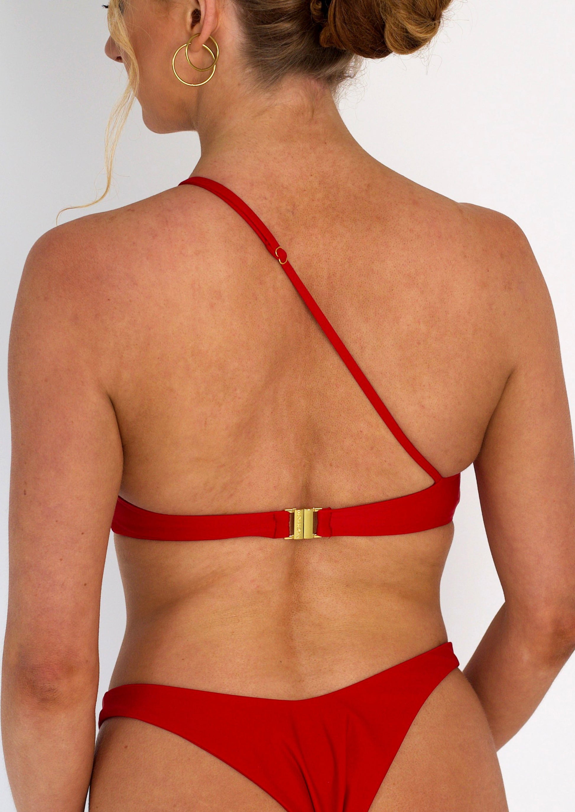 Ivy Asymmetric Bikini Top in Red with Gold Hardware - Back Close Up