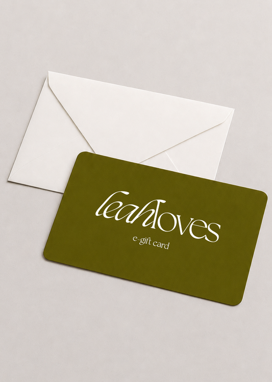 Green gift card with 'leahloves' branding and a white envelope on a light gray background