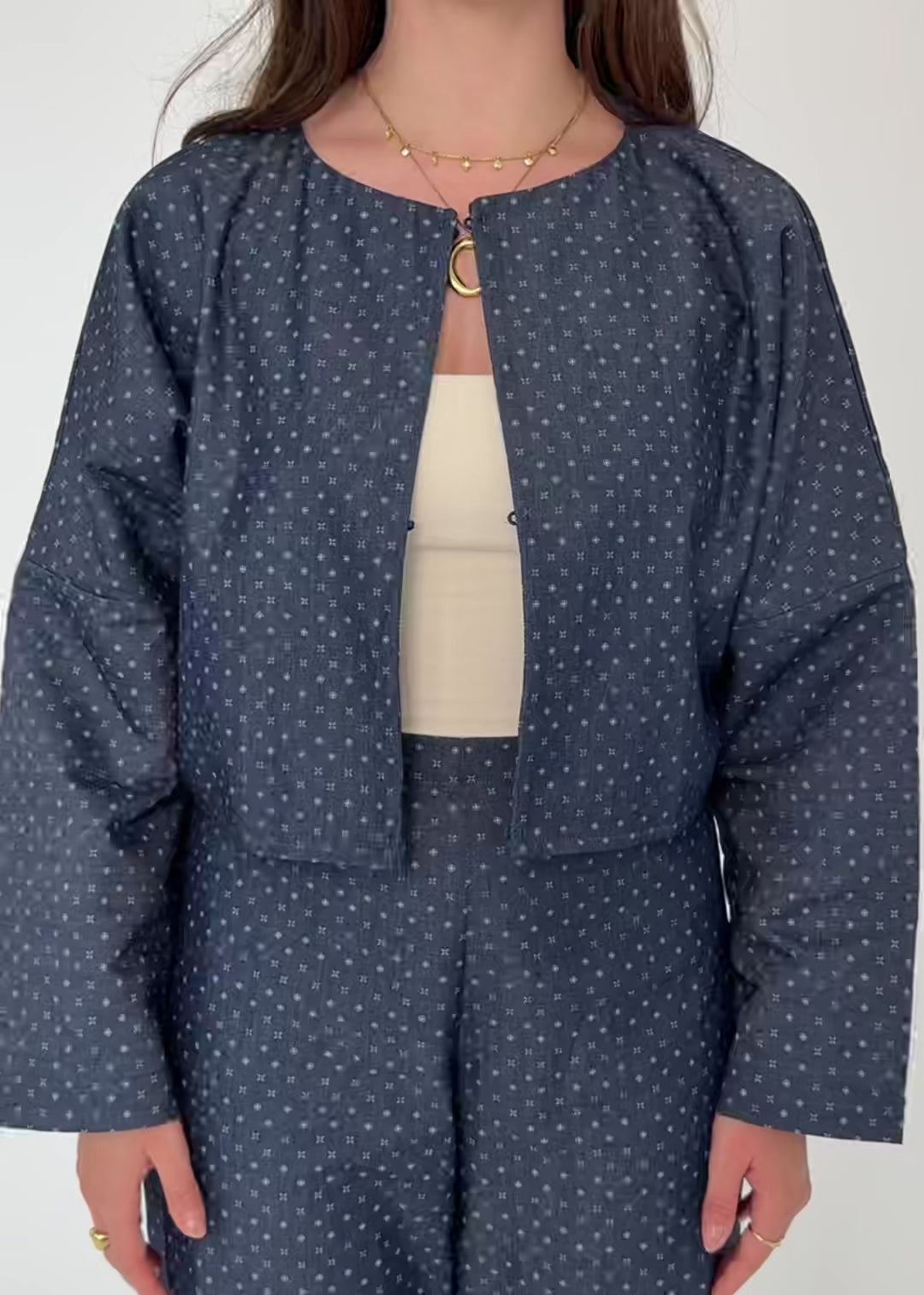video of model wearing blue and polka dot jacket 